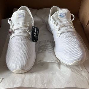 Never worn white New Balance tennis shoes.